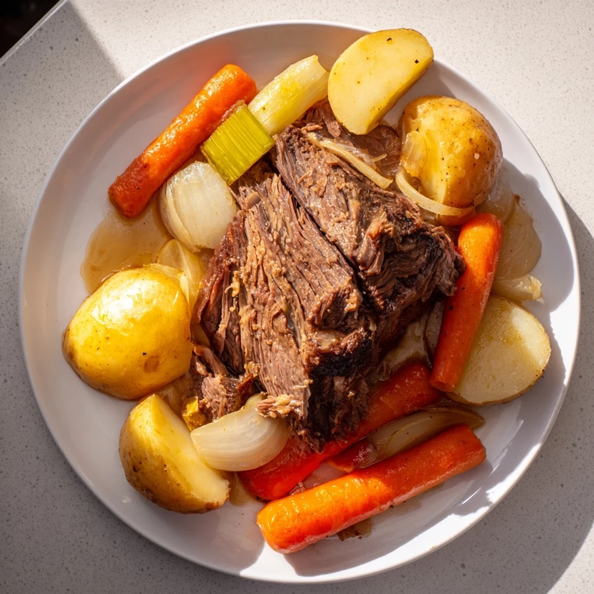 A close-up of a steaming Slow-Roasted Beef Pot Roast, rich with savory herbs and juices.