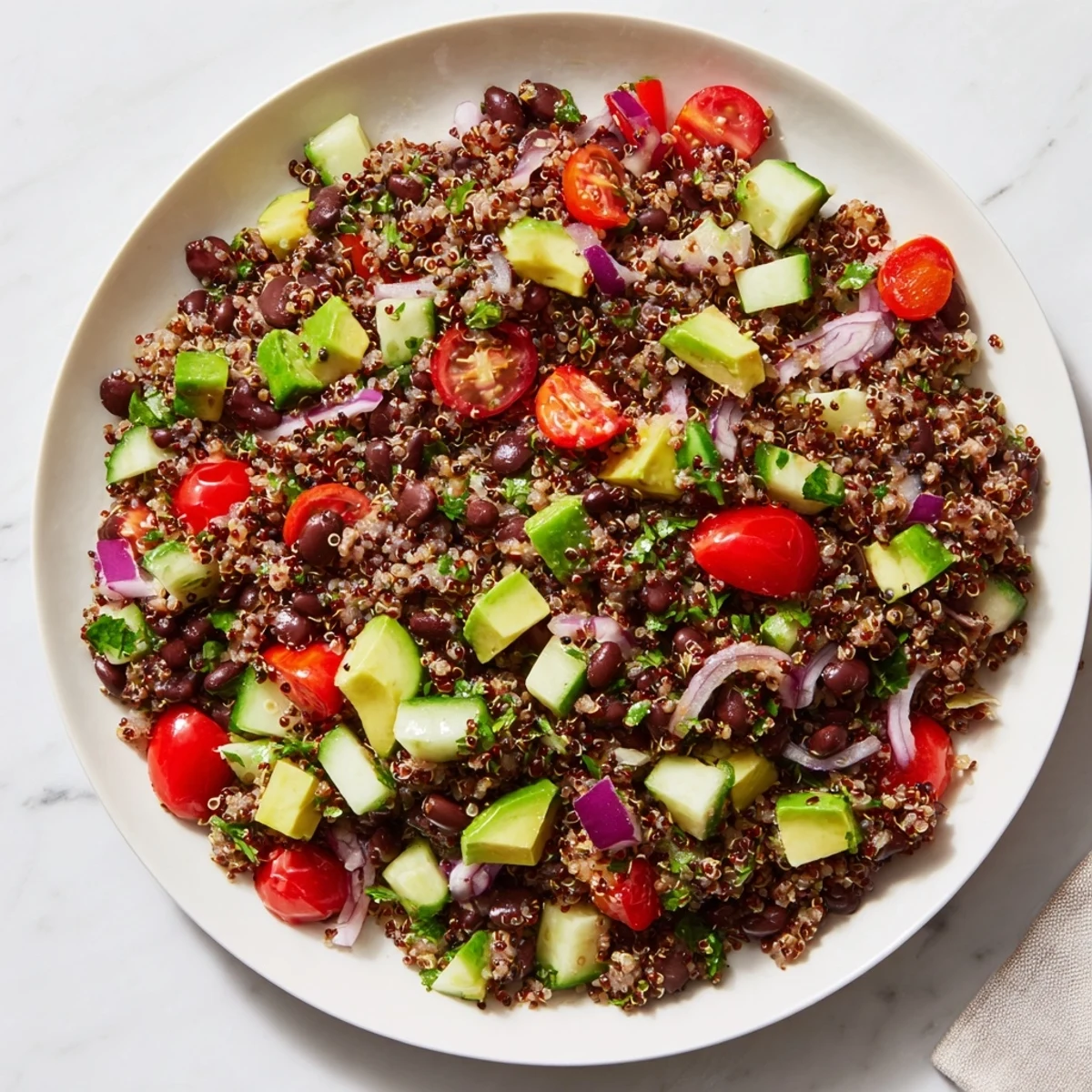 Vibrant image of a quinoa and black bean salad with lime, showcasing fresh ingredients.
