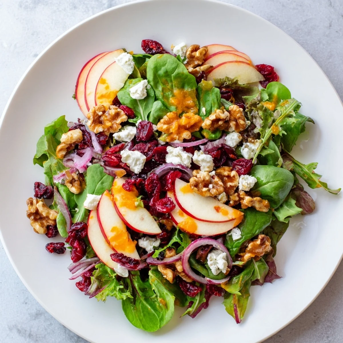 Enjoy a colorful view of the finished Seasonal Cranberry and Walnut Celebration Salad, perfect for any special occasion.