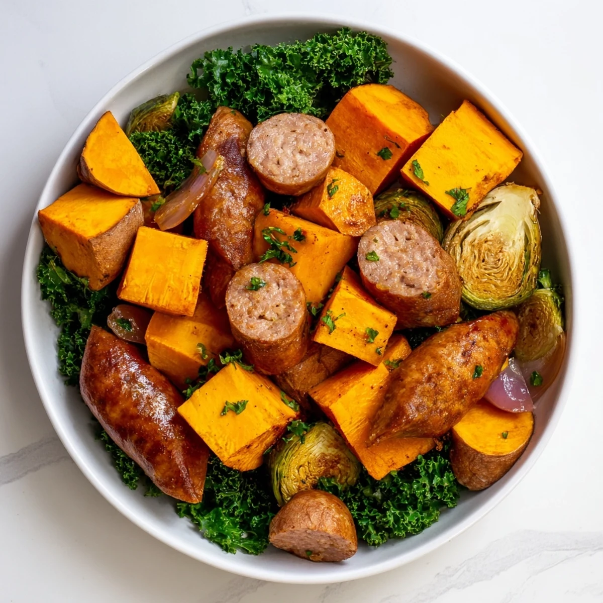 Golden-brown Hearty Sheet Pan Sausage and Autumn Veggie Medley, ready for a delicious dinner.