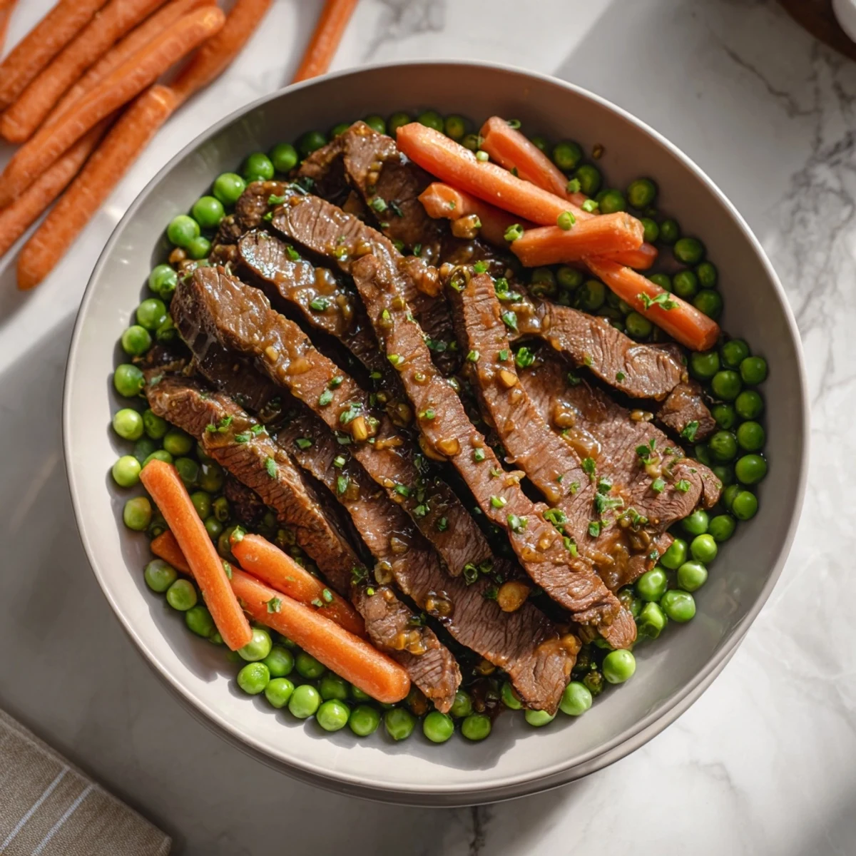 Delicious Skillet Beef Stir-Fry with tender beef and crisp vegetables, glistening in a flavorful sauce.