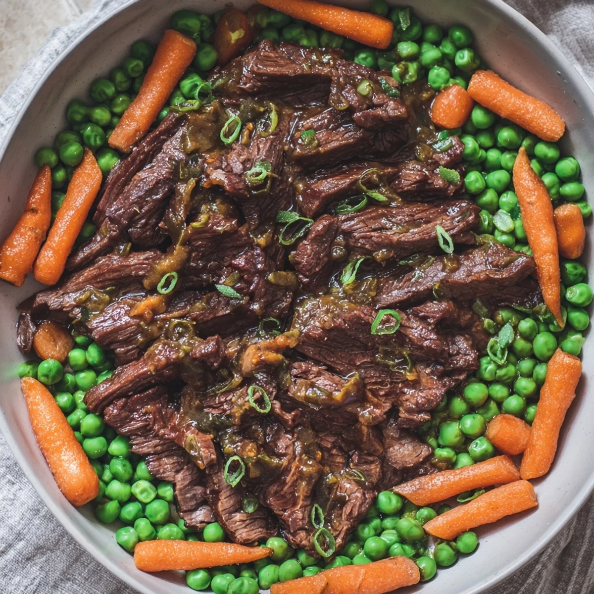 Vibrant Skillet Beef Stir-Fry with snap peas, carrots, and beef, ready to be served over rice.