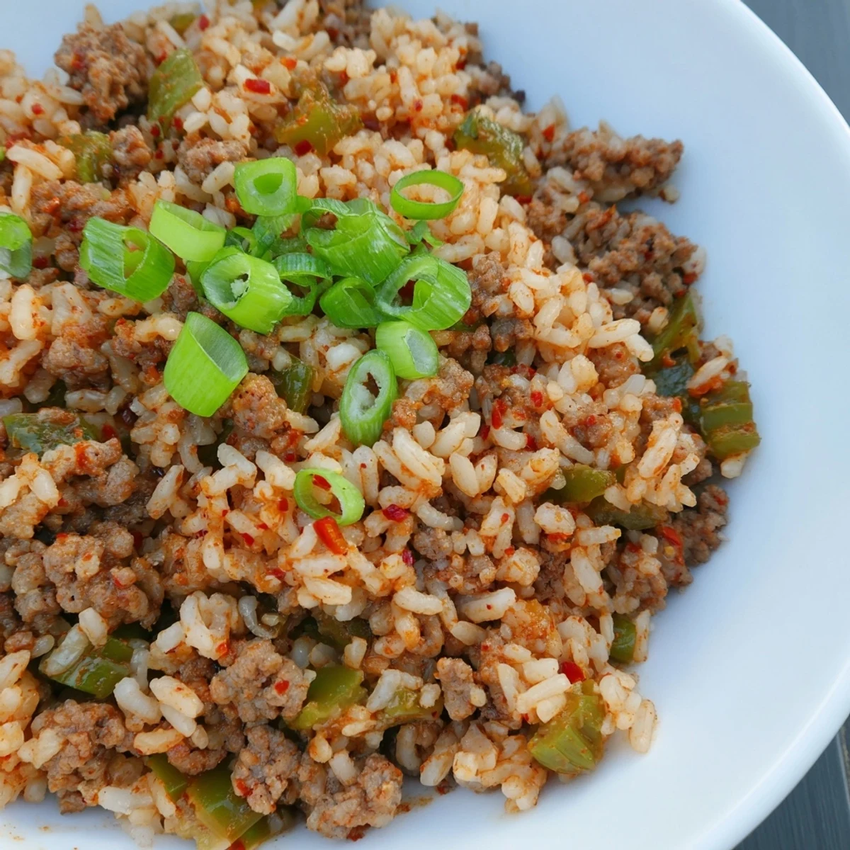 Serving suggestion: Enjoy a warm plate of Cajun Dirty Rice, a comforting and well-spiced meal.