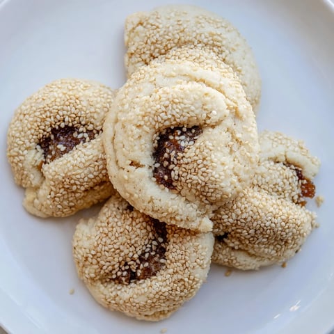Golden, sesame-studded Palestinian Kahk cookies, a delightful Middle Eastern treat for the holidays.