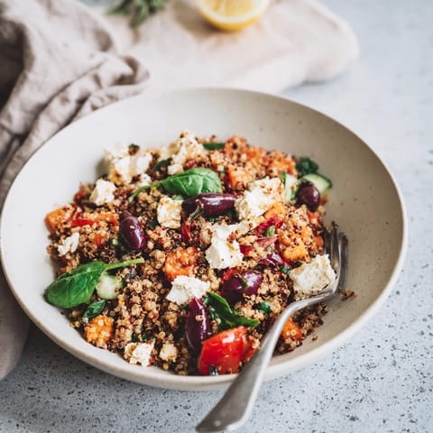 Vibrant Mediterranean Grain Bowl with roasted chickpeas and feta cheese, ready to eat, looks delicious.