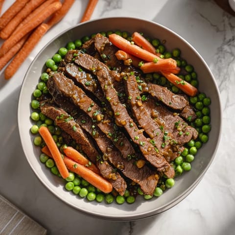Delicious Skillet Beef Stir-Fry with tender beef and crisp vegetables, glistening in a flavorful sauce.