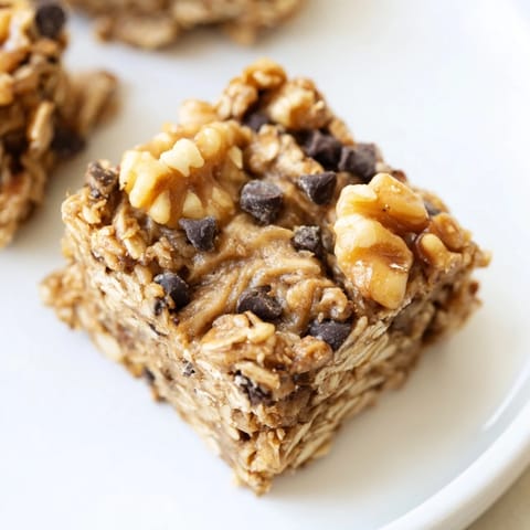 No-bake Peanut Butter Banana Oat Bars, offering a close-up of the delicious, layered energy snack.