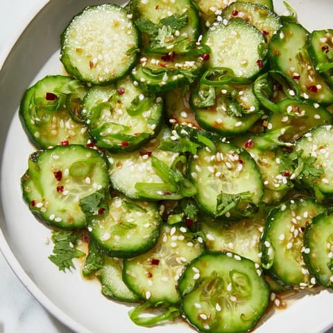 Crisp cucumber slices coated in tangy dressing create this delicious Zesty Shake Cucumber Salad.